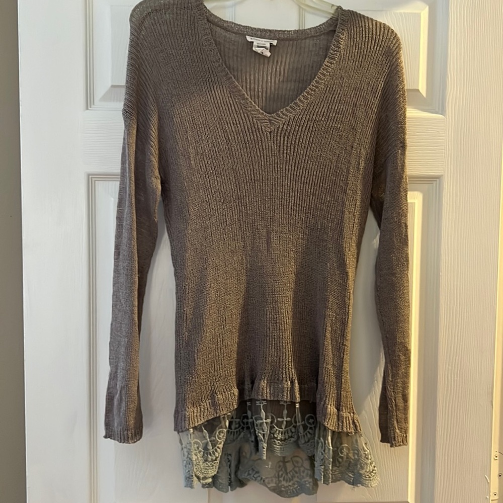 Tan lightweight sweater with lace detail along bottom